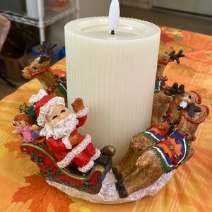 Selling candleholder sets of 6 baby reindeer, and Santa Claus in and his sled